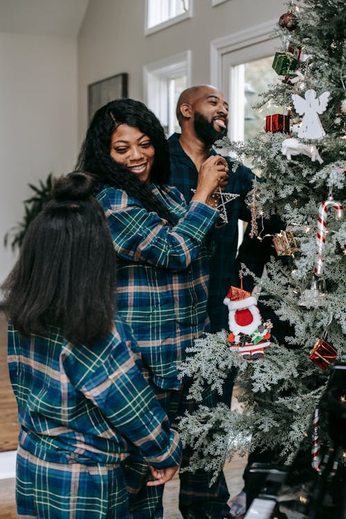 Cheerful black family enjoying Christmas preparation