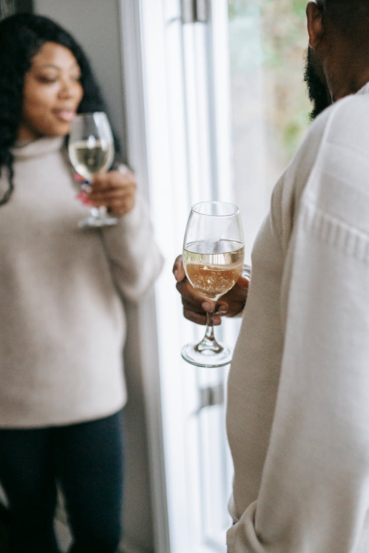 Crop Black Couple Drinking Champagne At Home