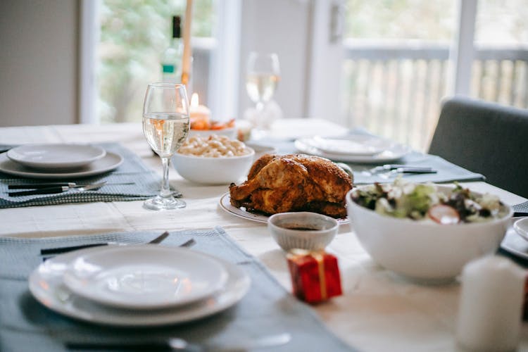 Table Setting With Traditional Christmas Dishes At Home