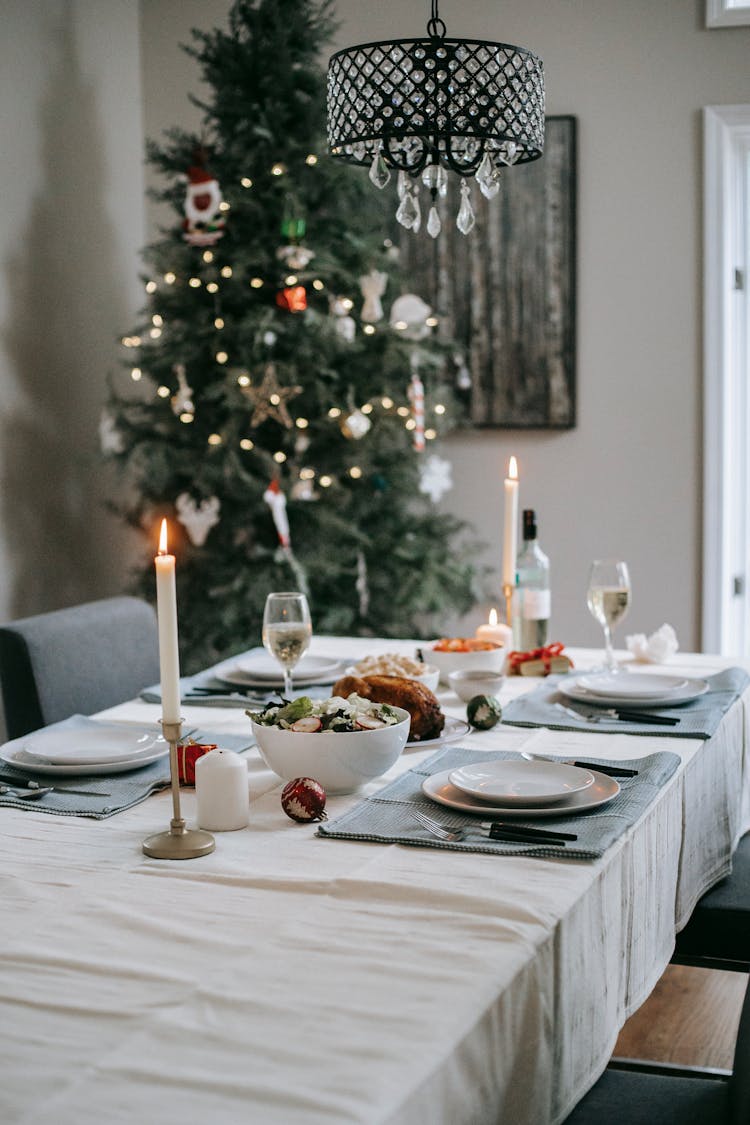 Served Table With Tasty Food Near Christmas Tree At Home