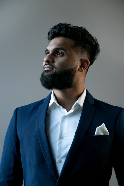Portrait of a Man with a Beard Wearing a Blue Suit