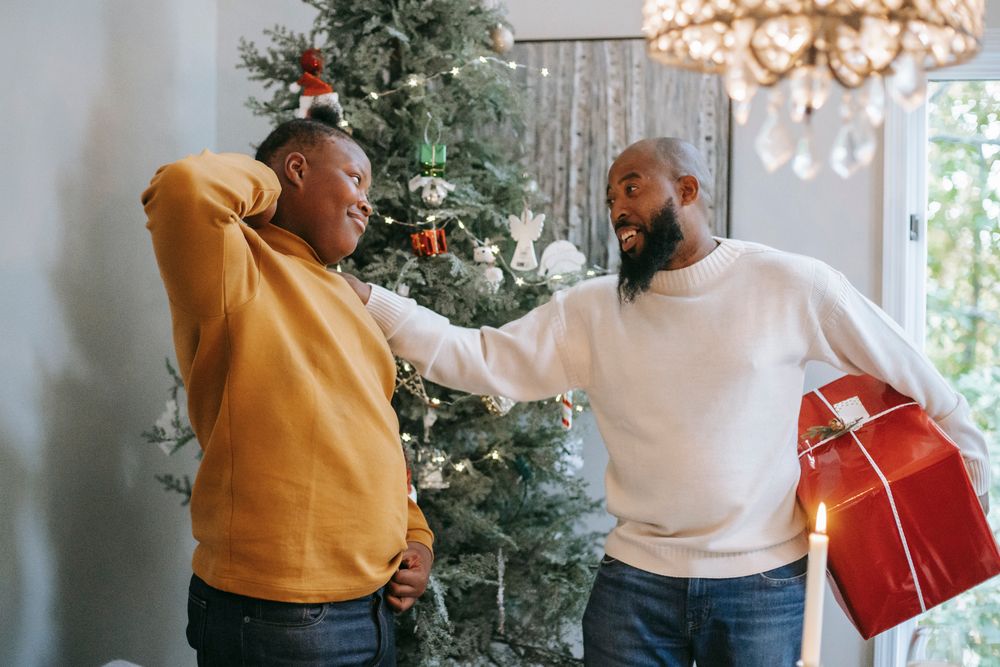 Father celebrating with a gift box