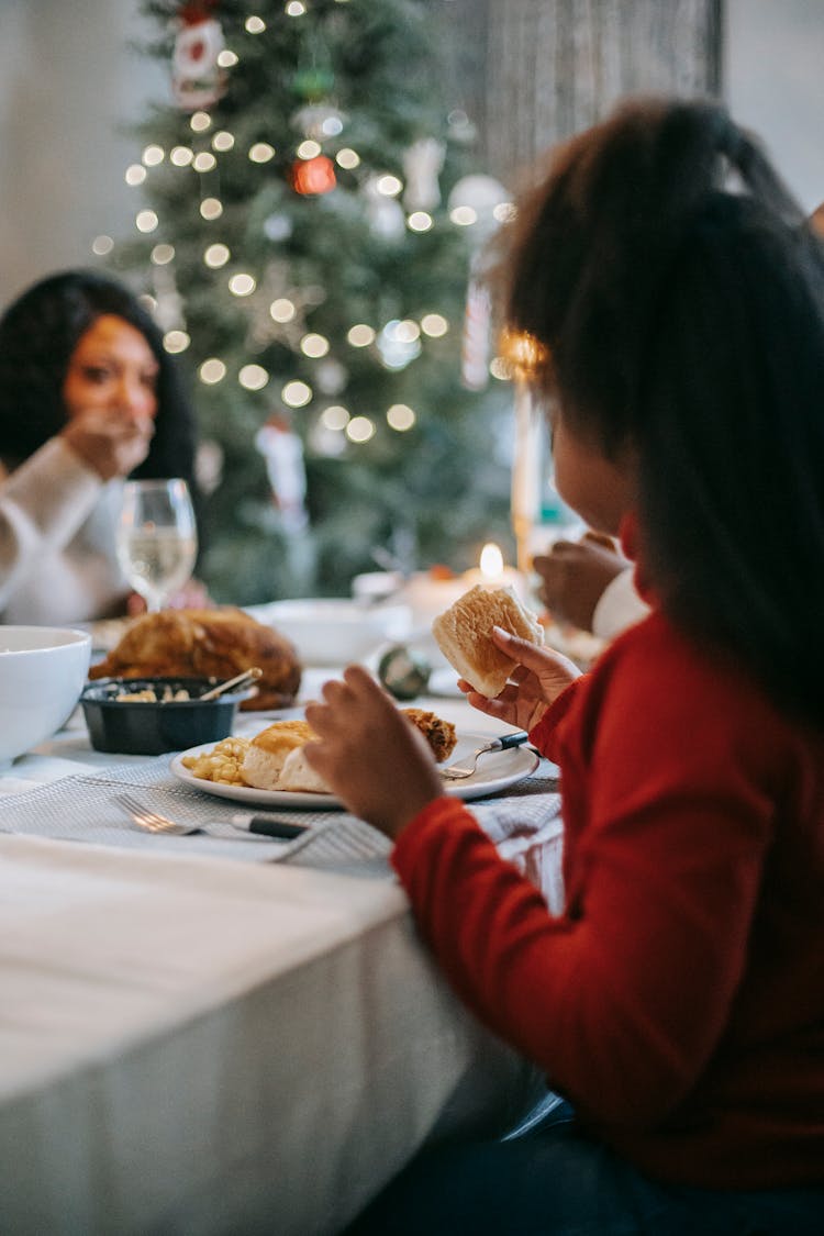 Black Girl Having Dinner At Table