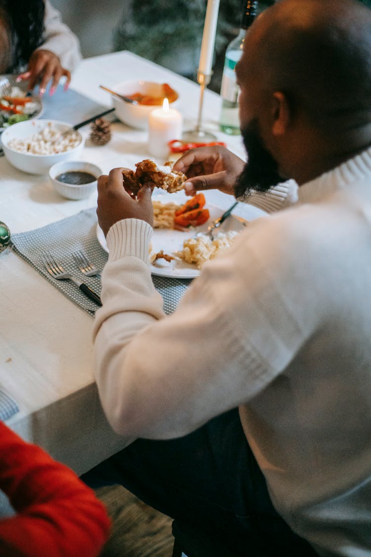 Black Couple Having Festive Dinner With Candles