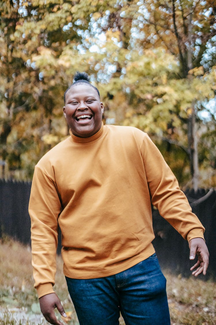 Happy Black Teen Laughing In Autumn Yard