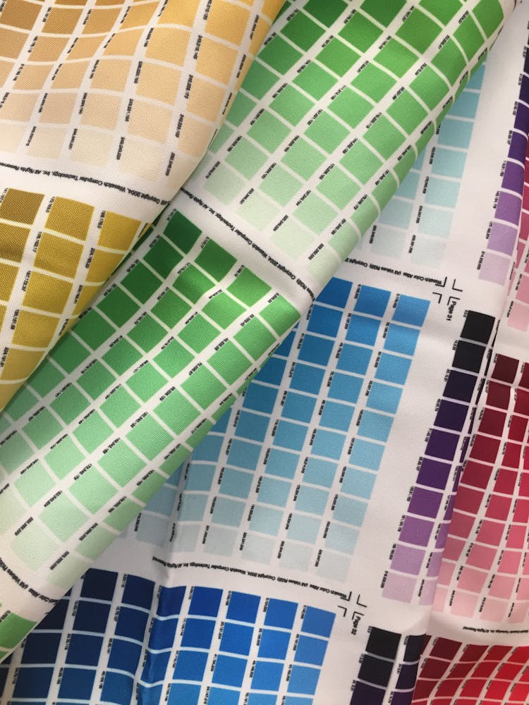 Close-up Of Color Palettes On Fabric