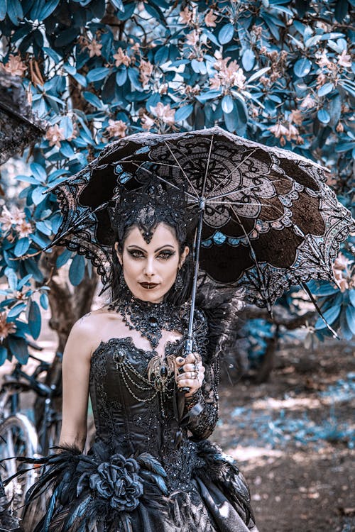Woman in a Costume Holding an Umbrella