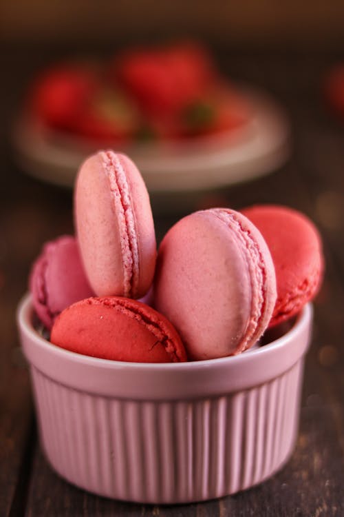 French Macarons On A Ceramic Cup