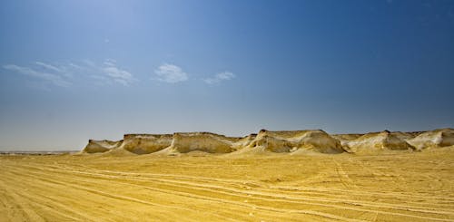 Sandstone hills in vast hot desert