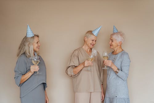 Free Photograph of Elderly Woman with Party Hats Stock Photo