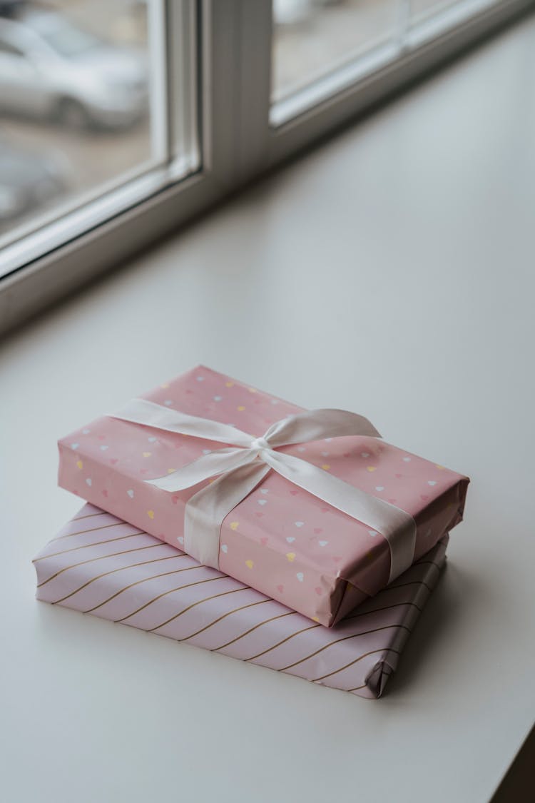 Photograph Of Gifts Wrapped In Pink Wrapping Paper