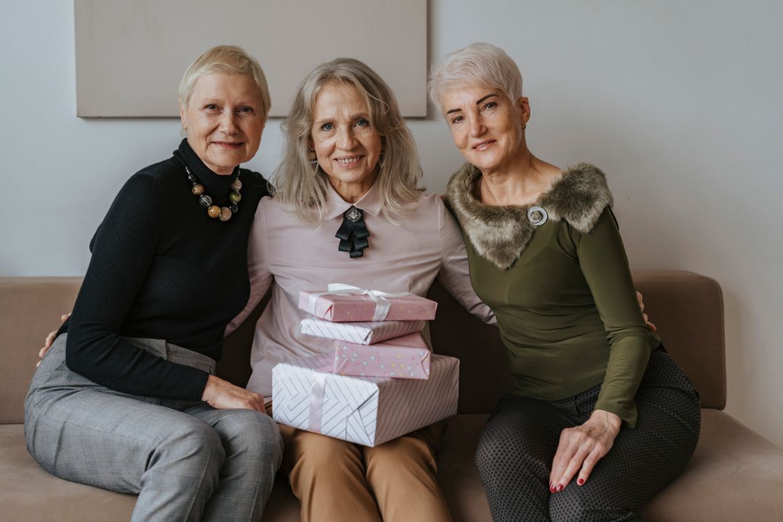 Ladies Group R Group of Women Sitting Together on a Couch · Free Stock Photo