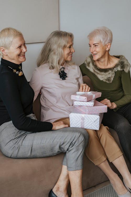 Free Women Sitting with Gifts Stock Photo