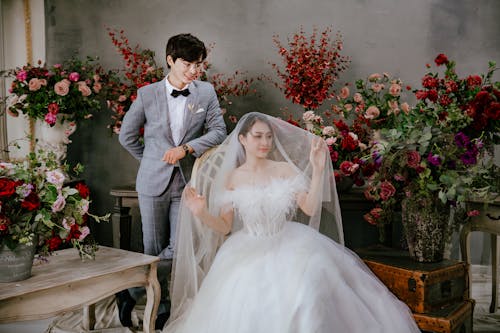 Portrait of Bride and Groom with Lots of Flowers