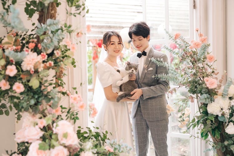 Happy Bride And Groom With Cat