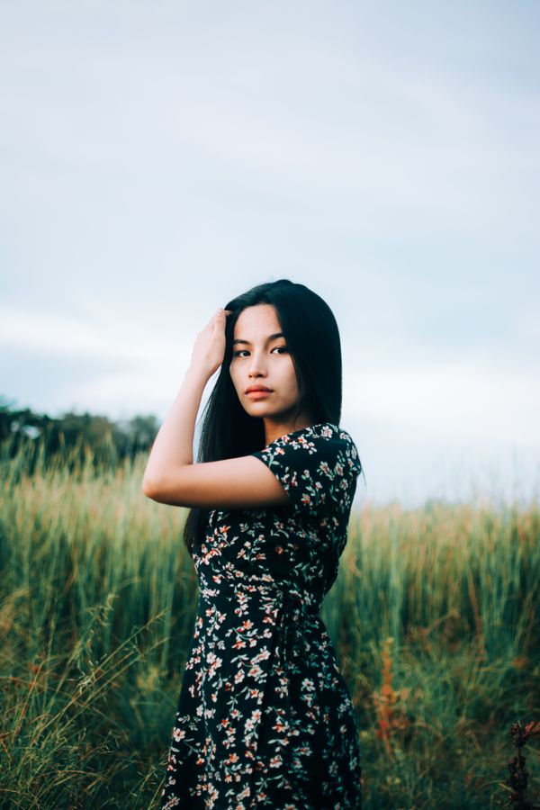 Woman wearing dark floral tea dress