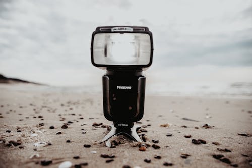 A Camera Flash on a Beach