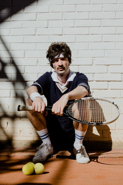 A Man Holding a Tennis Racket