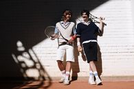 Man in Blue and White Polo Shirt Holding Tennis Racket