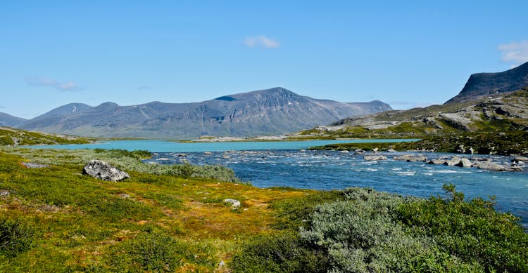 River Flowing In Mountain Nature Landscape