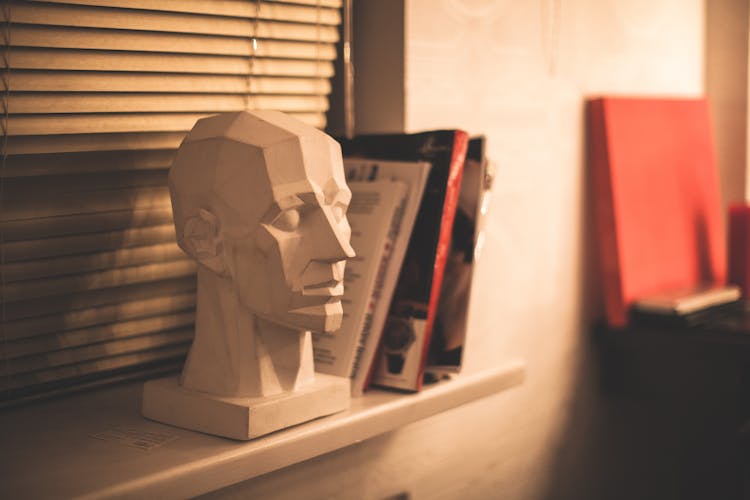 Close-Up Photograph Of A Head Figurine