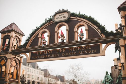 Free Charming Christmas market entrance with festive decorations and elf sculptures in Cologne, Germany. Stock Photo