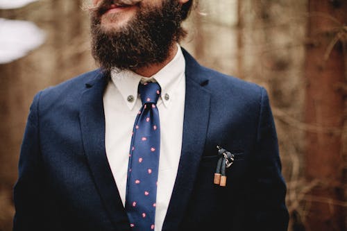 Photo of a Man with a Beard Wearing a Blue Neck Tie