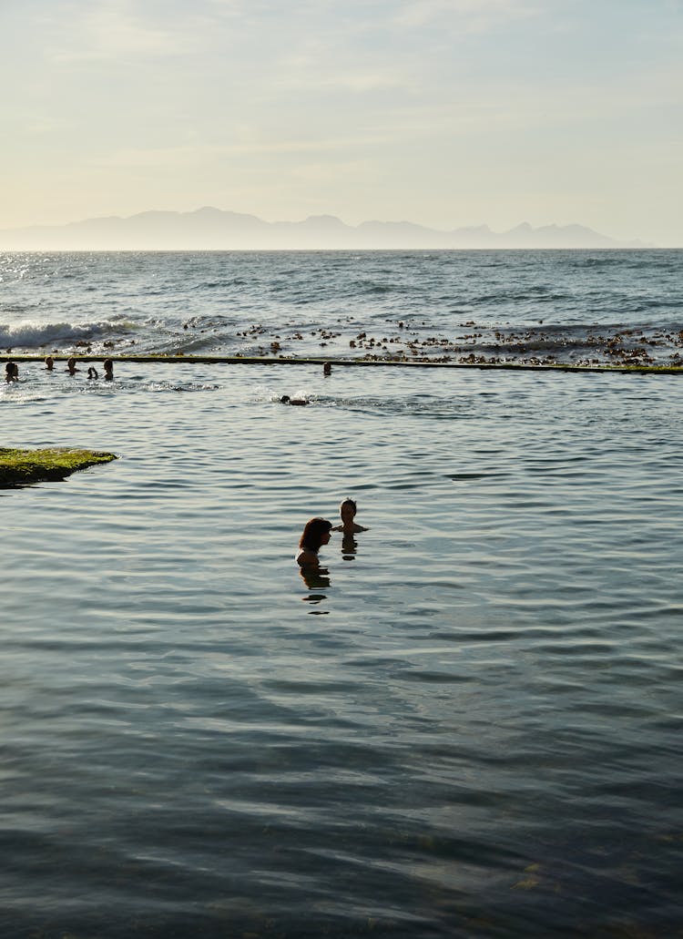 People Swimming On The Tidal Pool