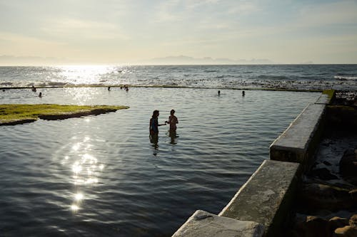 People Swimming on Water 