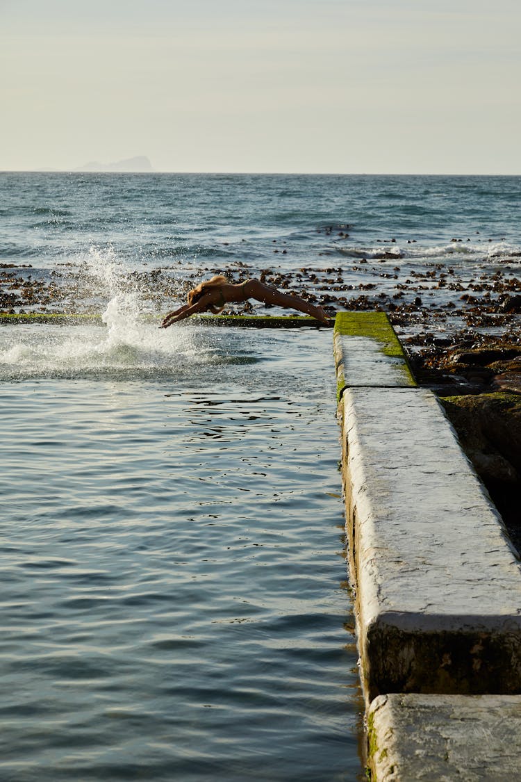 Woman Diving On The Tidal Pool