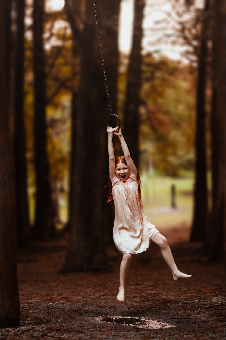 Girl Hanging On Swing