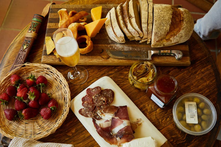 Sliced Bread And Cheese On A Wooden Board