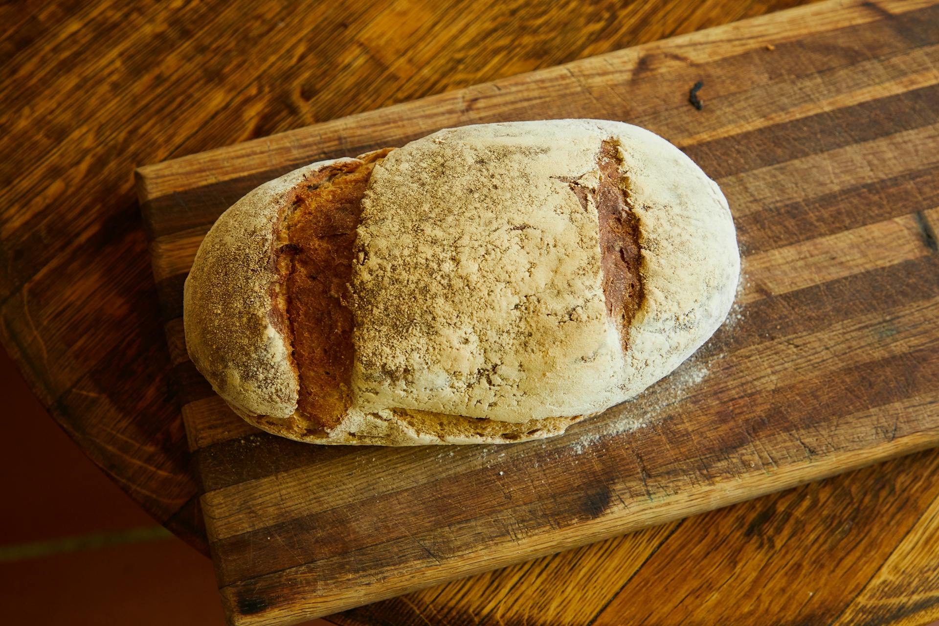 Top View of a Loaf of Bread on a Cutting Board