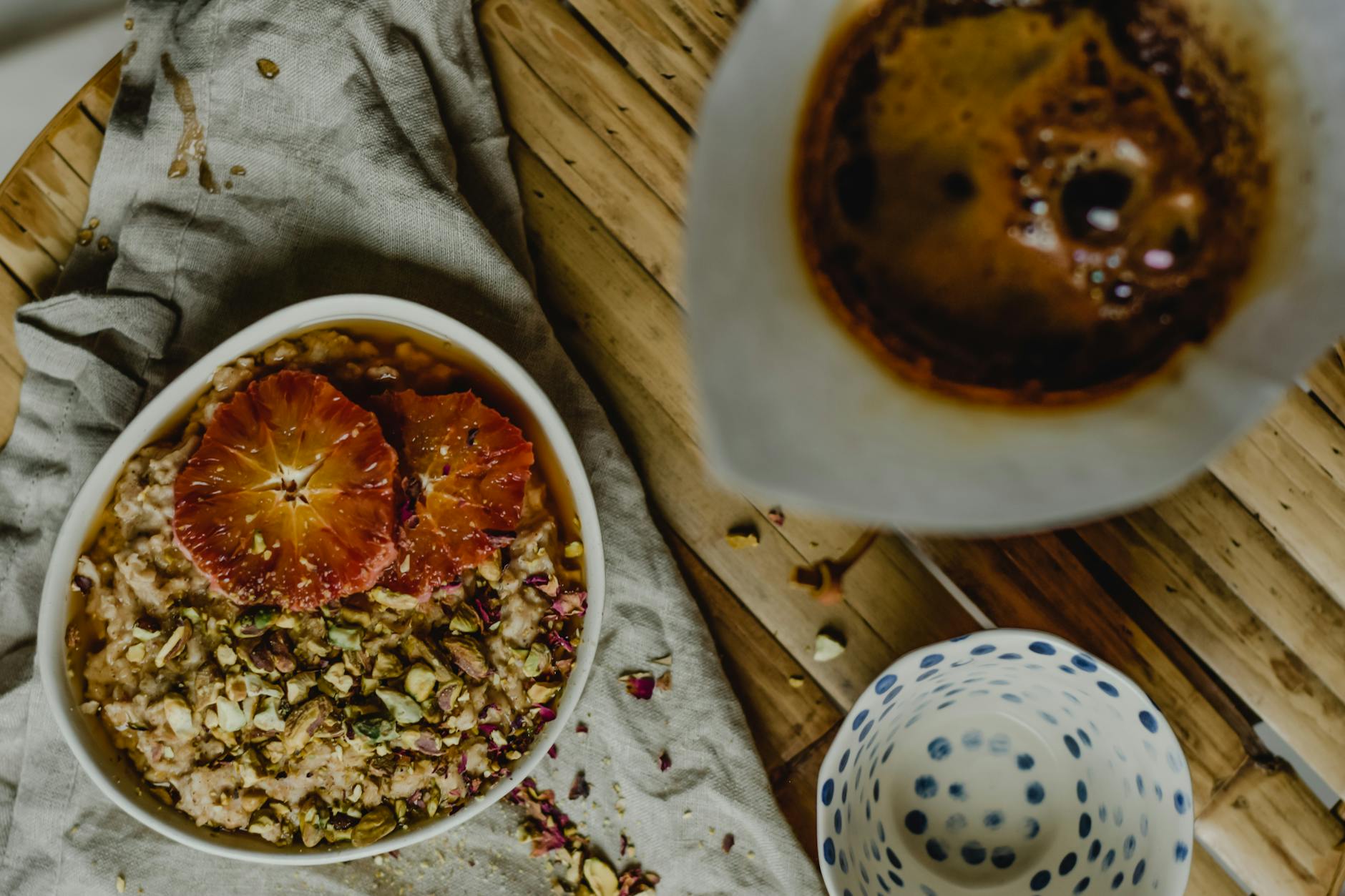 Pistachios In A Bowl On A Wooden Table With A Calming Evening Background