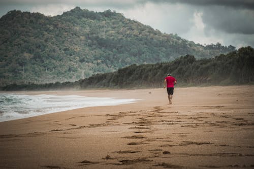 A Man Running Near the Seashore