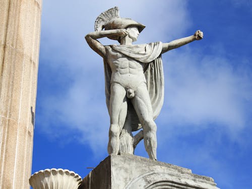 Statue of a Naked Man With a Cape 