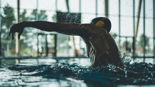 Free A swimmer in motion, captured at an indoor pool in Aix-en-Provence, France. Stock Photo
