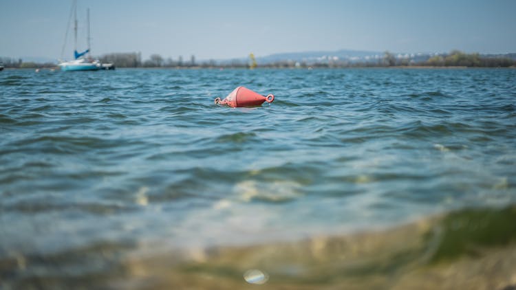 Red Floating Object On Water