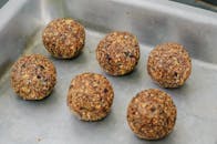 Rows of delicious energy balls in baking pan