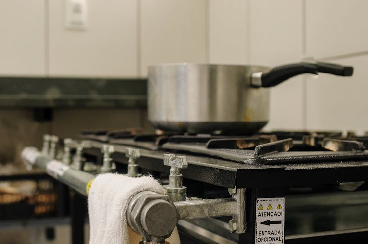 Metal Saucepan On Gas Stove In Kitchen