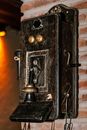 Shabby retro telephone hanging on wall