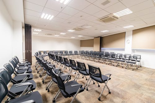 Free Empty seats in conference room in office center Stock Photo
