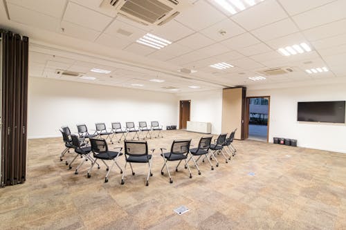Armchairs placed in circle in conference room