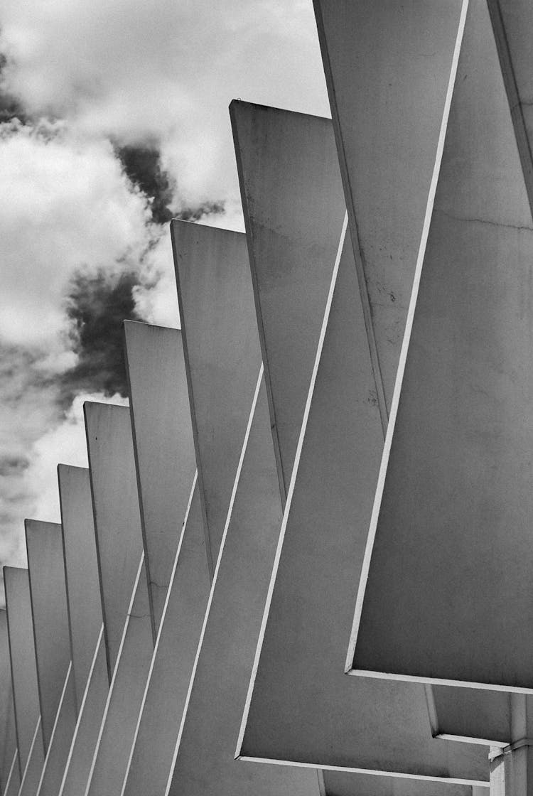 Geometric Triangle Concrete Construction Under Clouds