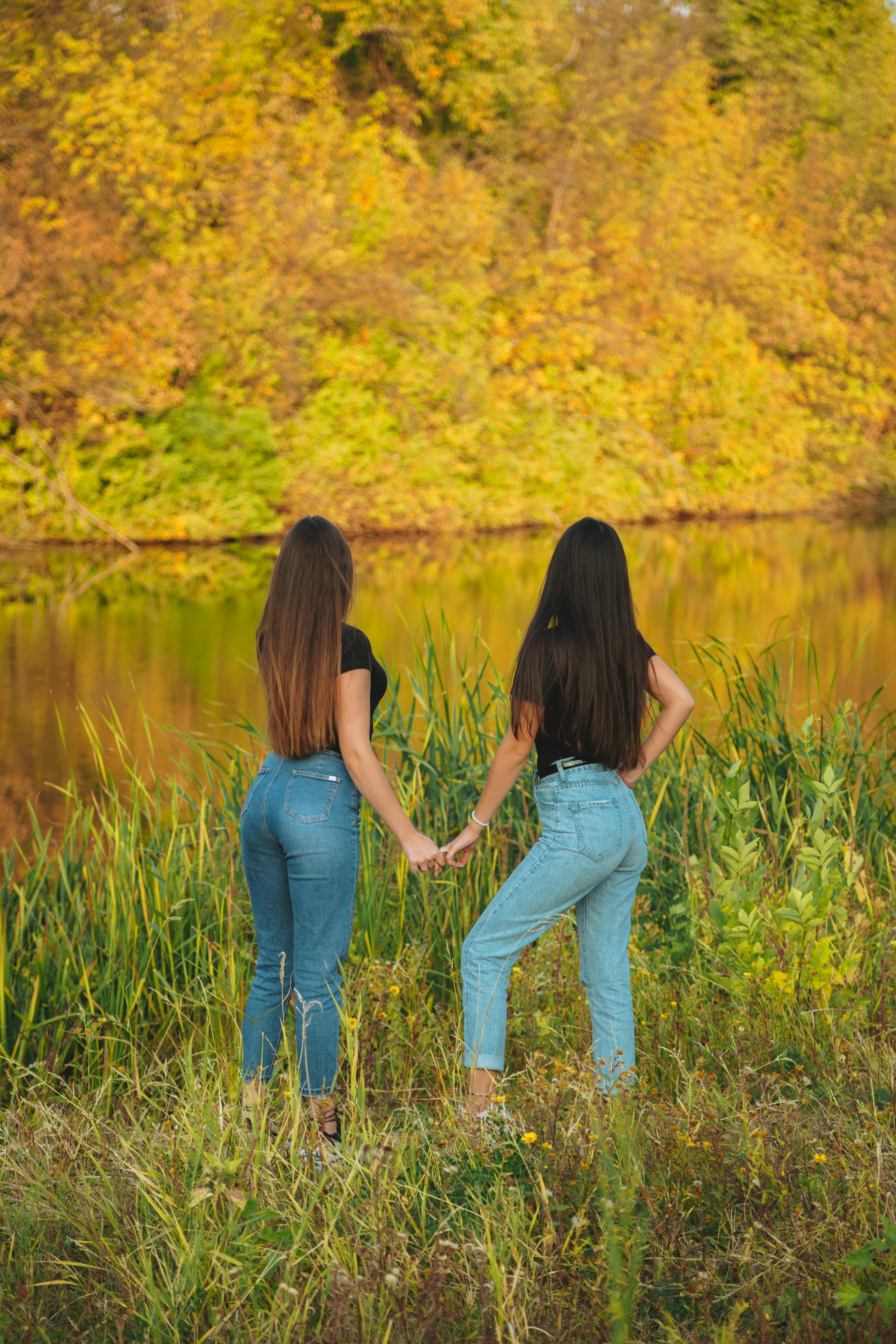 unrecognizable couple standing near river