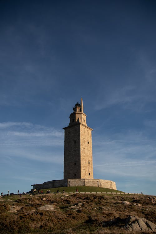 Brown Concrete Tower Under Blue Sky