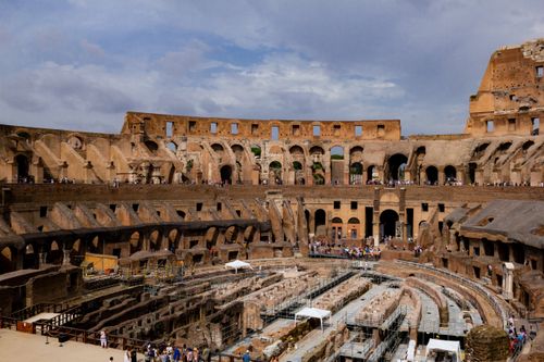 Free Explore the historic interior of the Roman Colosseum showcasing ancient architecture and grandeur. Stock Photo