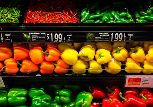 Bell Peppers and Chilies on a Display Shelf