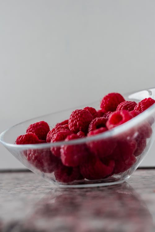 Raspberries in a Clear Glass Bowl