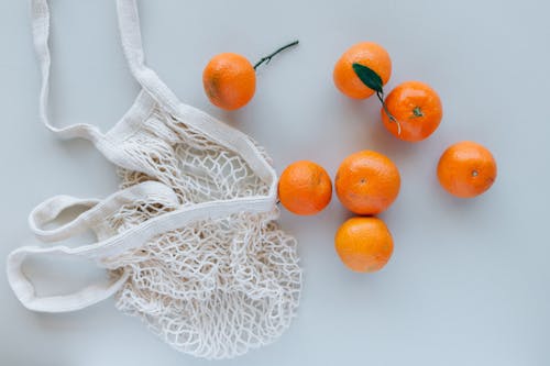 無料 オレンジ色の果物, ハイアングルショット, みかんの無料の写真素材 写真素材